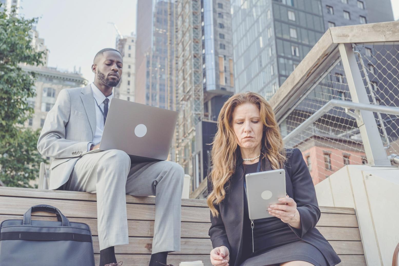Person working at home desk with natural lighting and organized workspace setup